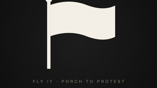 A waving flag on a pole, flat off-white on black — the practical guide to flying a protest flag
