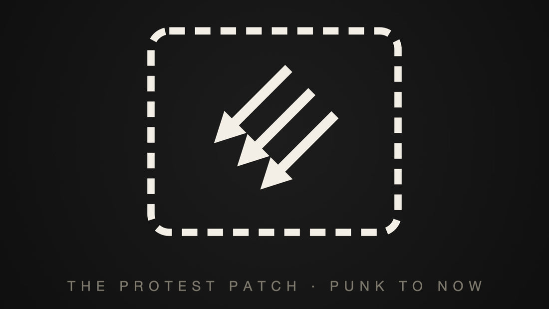 A stitched rectangular patch carrying three downward arrows — the protest patch, punk to now